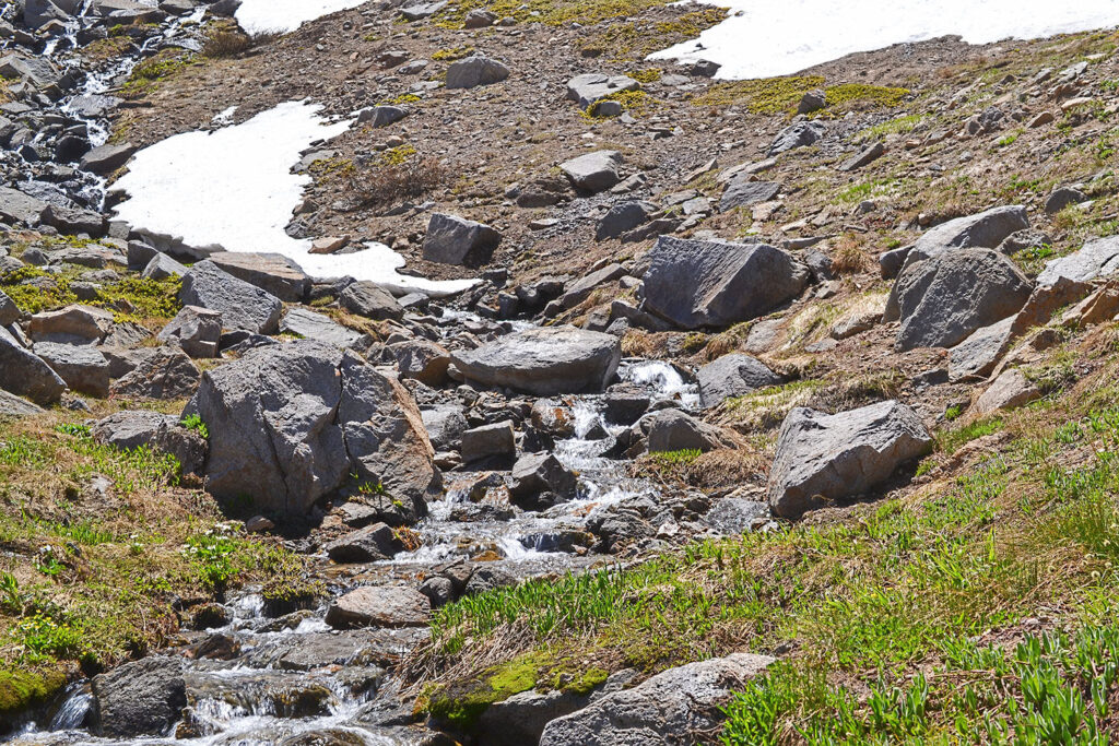 Snow melting in the Sierra Nevada in the summer along the Pacific Crest Trail near Carson Pass